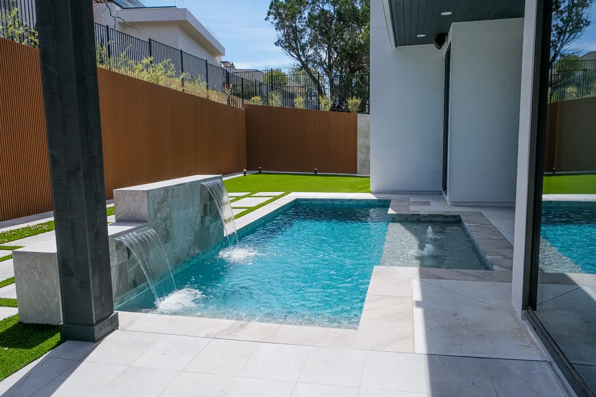 A private Ambia courtyard pool with cascading water