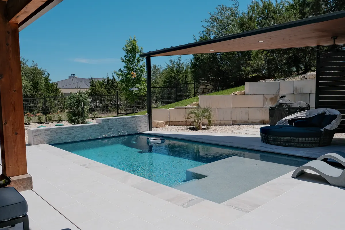 Poolside pavilion with a covered lounge